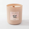 Pink candle with 'Les Bois' label on a white background