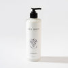 White bottle of 'Les Bois' conditioner with a black pump on a white background