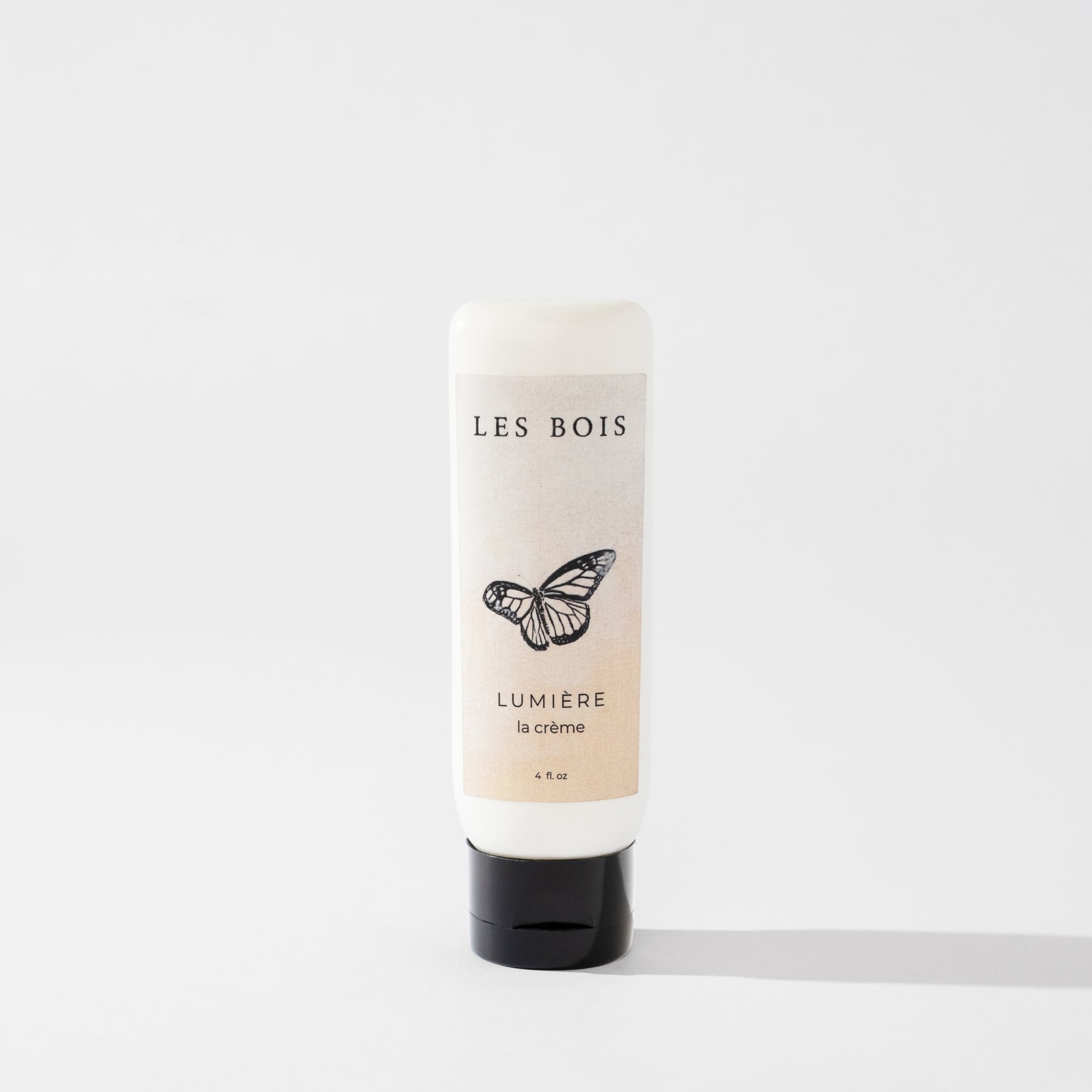 Skincare bottle labeled 'Les Bois' with a butterfly design on a white background